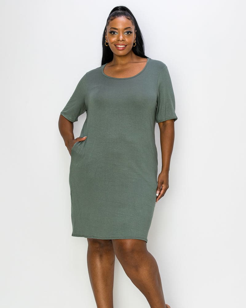 Front of a model wearing a size 1X Emily Pocket T-Shirt Dress in Olive Lt by L I V D. | dia_product_style_image_id:241040